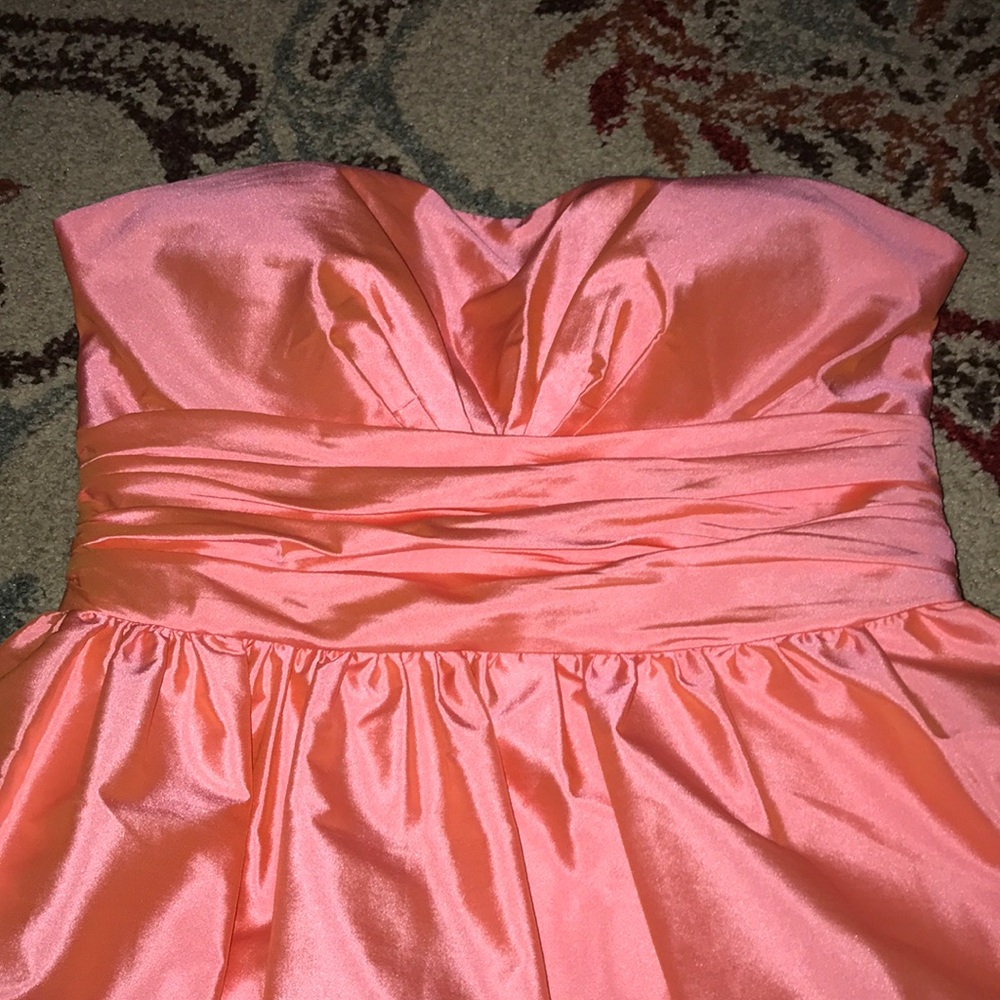 a short sleeveless coral prom dress